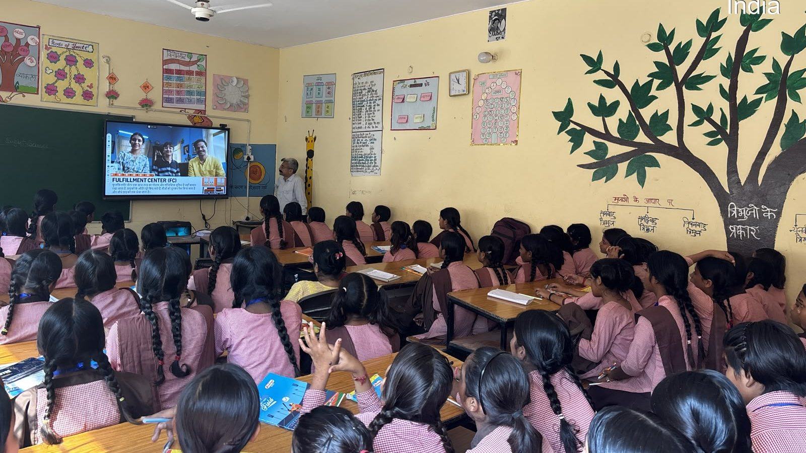 A classroom of students watching an AI awareness session on screen
